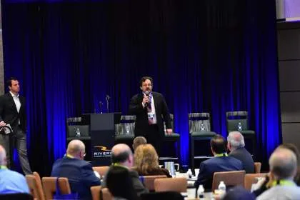 LogicalNet CEO Tush Nikollaj delivering keynote at Tech Valley Cybersecurity Symposium, Rivers Casino & Resort