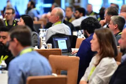 Attendees taking notes during session at Tech Valley Cybersecurity Symposium